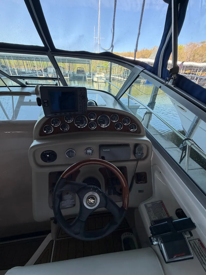 Slide: The Image of Helm of 2001 Sea Ray 290 Sundancer with instruments. - 9