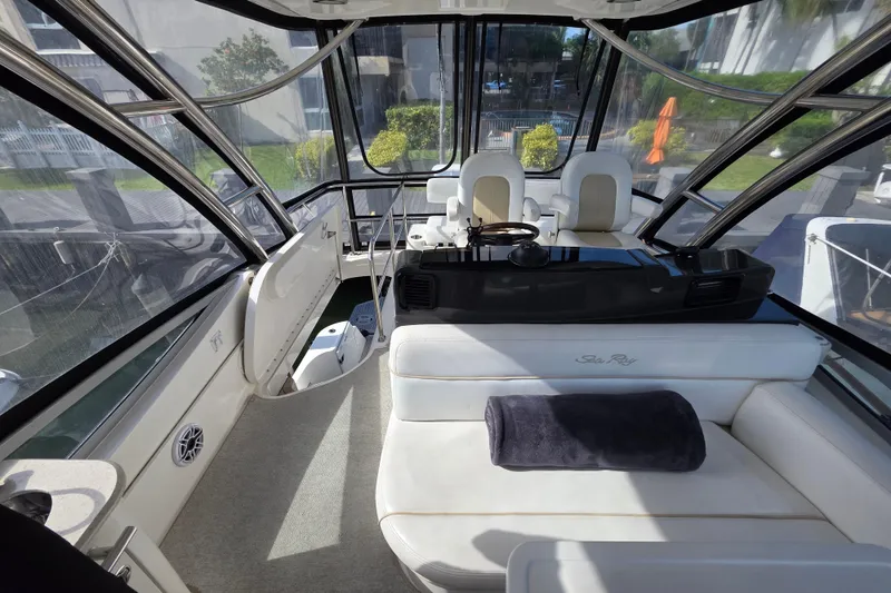 Slide: The Image of Interior view of a 2008 Sea Ray 47 Sedan Bridge yacht with plush seating and helm. - 15