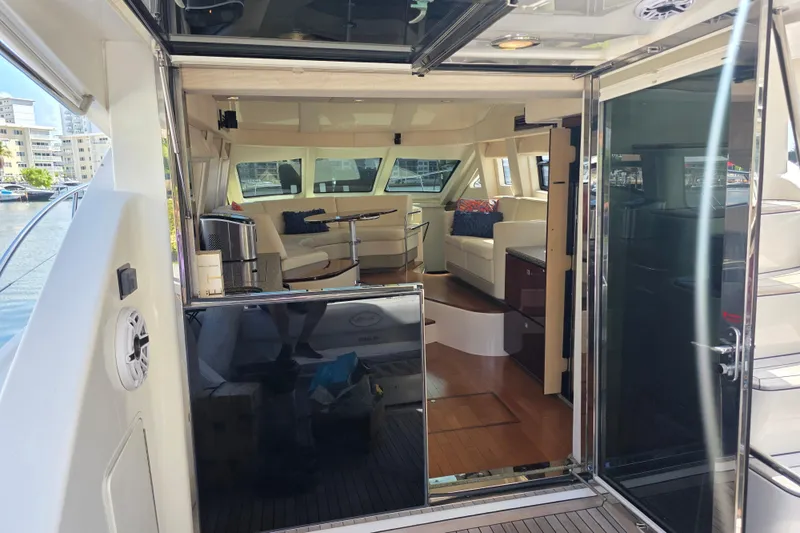 Slide: The Image of Interior view of 2008 Sea Ray 47 Sedan Bridge yacht, featuring luxurious seating and modern design. - 18