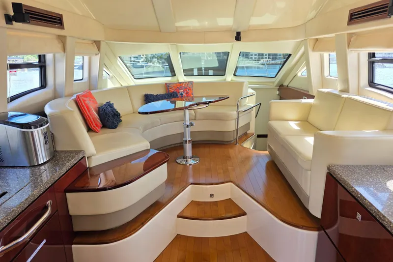Slide: The Image of Luxurious interior of 2008 Sea Ray 47 Sedan Bridge yacht with elegant seating and modern decor. - 20