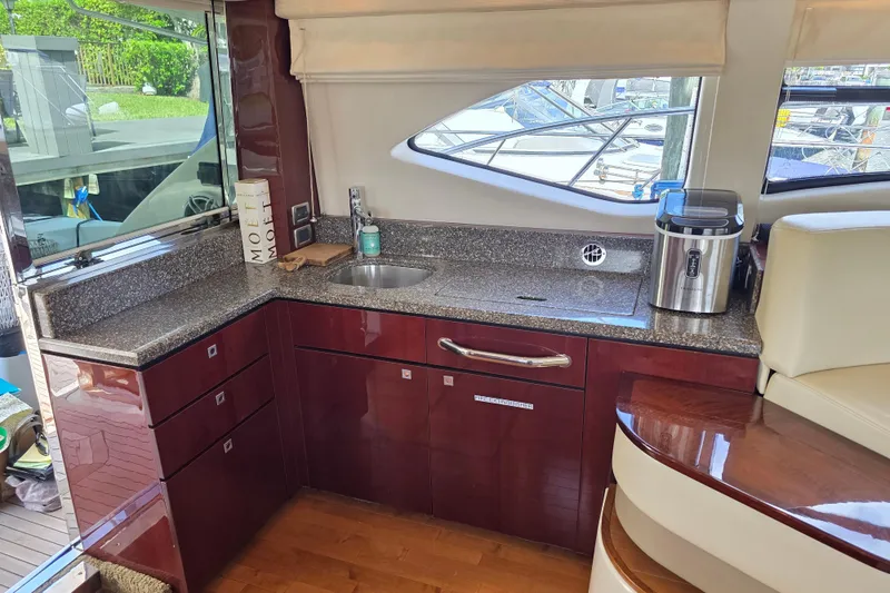 Slide: The Image of Luxurious 2008 Sea Ray 47 Sedan Bridge yacht kitchen with granite countertops and modern appliances. - 21