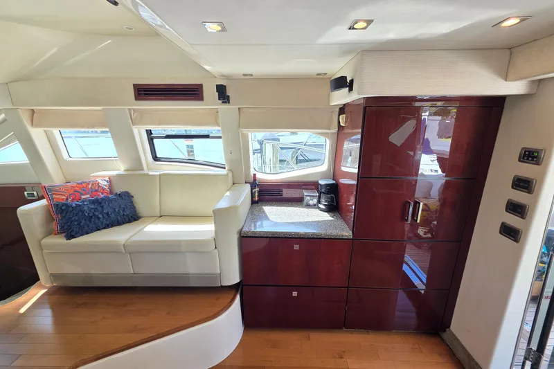 Slide: The Image of Luxurious interior of 2008 Sea Ray 47 Sedan Bridge yacht with modern seating and cabinetry. - 24