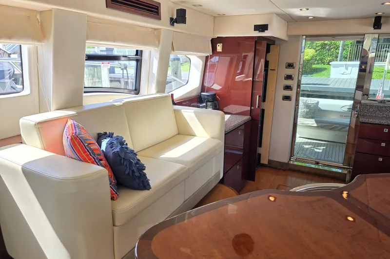 Slide: The Image of Luxurious interior of 2008 Sea Ray 47 Sedan Bridge yacht with plush seating and modern decor. - 27