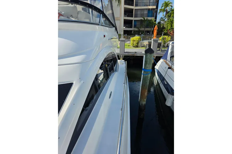 Slide: The Image of 2008 Sea Ray 47 Sedan Bridge yacht docked at marina, side view. - 3