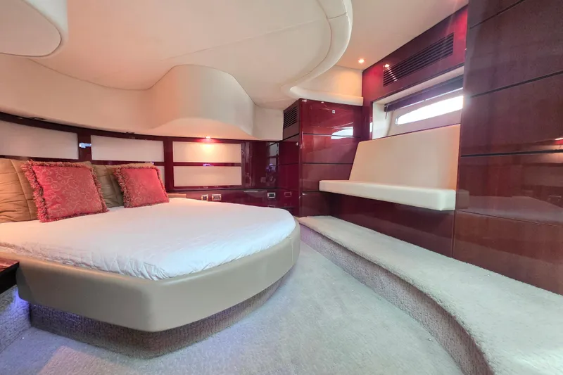 Slide: The Image of Luxurious interior of 2008 Sea Ray 47 Sedan Bridge yacht with elegant bedding and seating. - 31