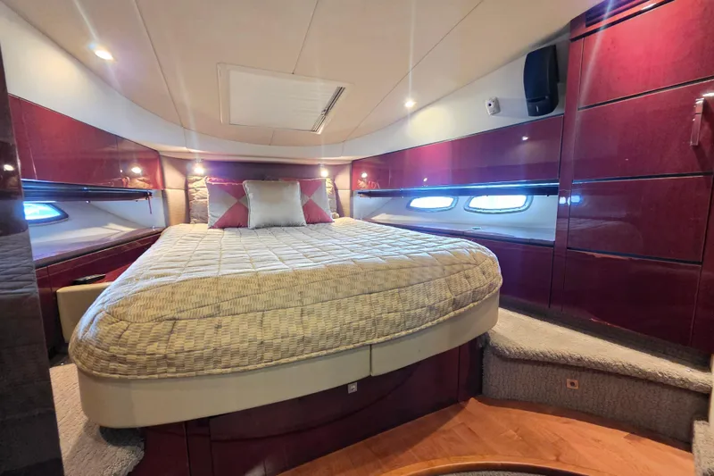 Slide: The Image of Luxurious bedroom interior of 2008 Sea Ray 47 Sedan Bridge yacht with elegant wood finishes. - 33