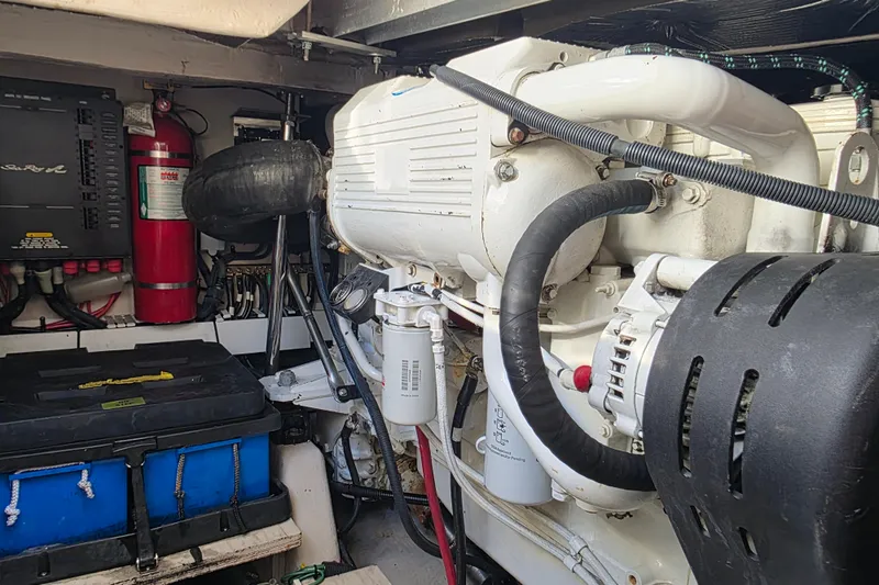 Slide: The Image of Engine room of a 2008 Sea Ray 47 Sedan Bridge, featuring mechanical components and safety equipment. - 35