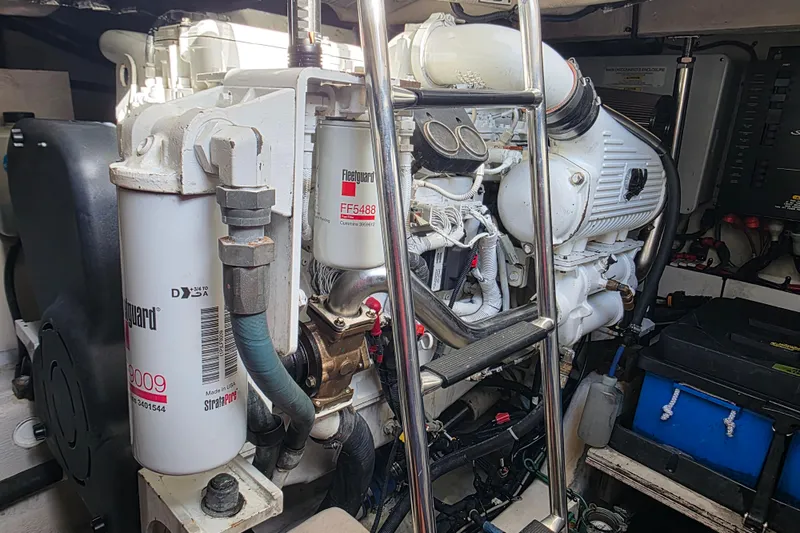 Slide: The Image of Engine room of a 2008 Sea Ray 47 Sedan Bridge with visible components and filters. - 36