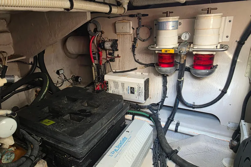 Slide: The Image of Engine room of a 2008 Sea Ray 47 Sedan Bridge with fuel filters and wiring. - 39