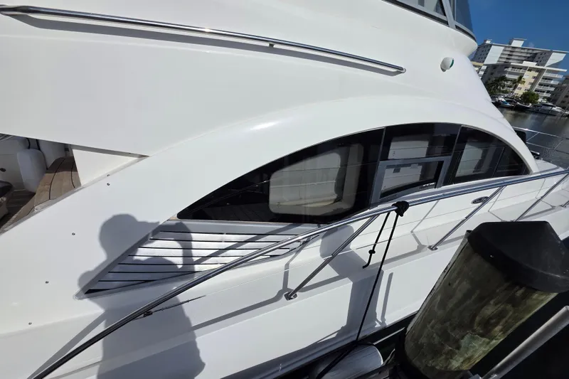 Slide: The Image of 2008 Sea Ray 47 Sedan Bridge yacht docked, showcasing sleek design and modern architecture. - 4