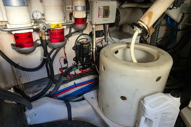 Slide: The Image of Engine room of a 2008 Sea Ray 47 Sedan Bridge with filters and hoses. - 40