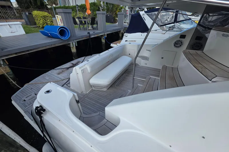 Slide: The Image of 2008 Sea Ray 47 Sedan Bridge yacht with spacious deck and seating area. - 6