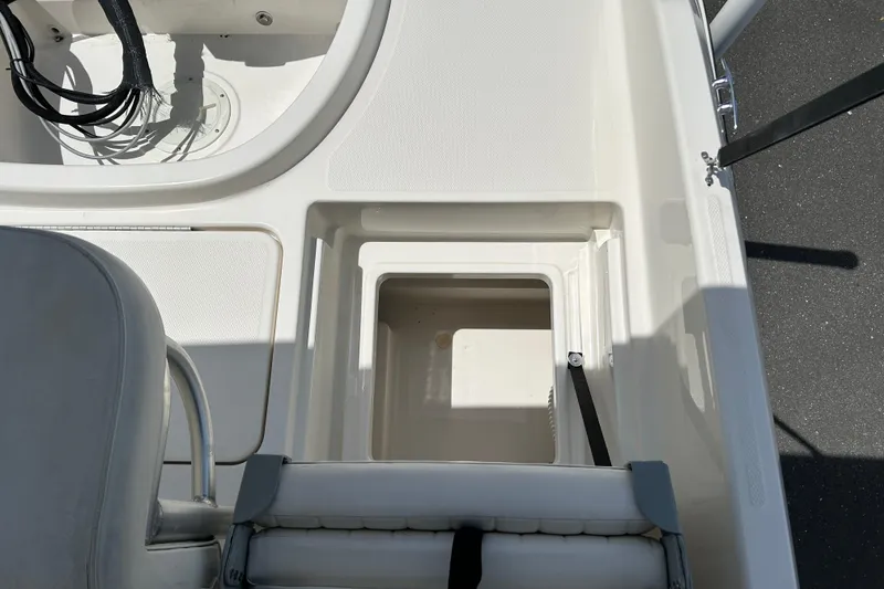 Slide: The Image of 2018 Bayliner Element F16 boat interior storage compartment. - 18