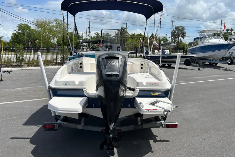Slide: The Image of 2018 Bayliner Element F16 boat with Mercury 75 engine, parked outdoors. - 3