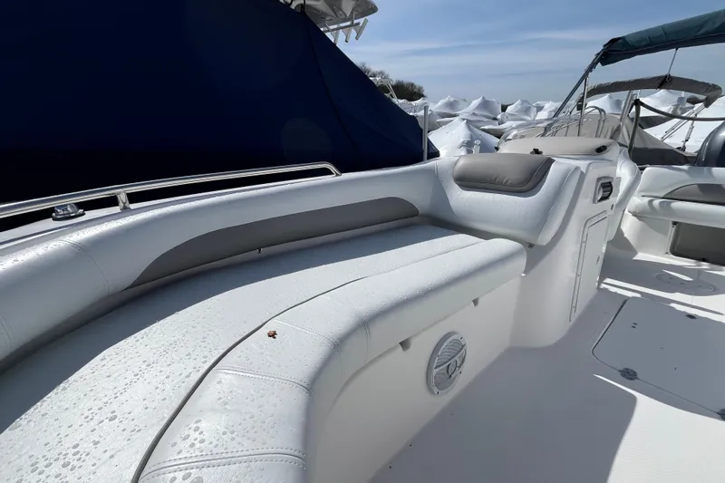 Slide: The Image of 2015 Hurricane SunDeck Sport 201 OB boat interior with white seating and sleek design. - 15
