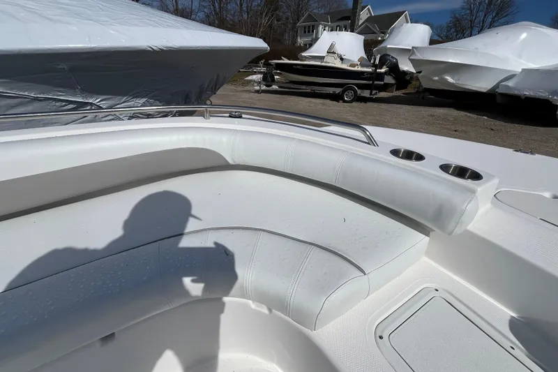 Slide: The Image of 2015 Hurricane SunDeck Sport 201 OB boat interior with white seating and cup holders. - 16
