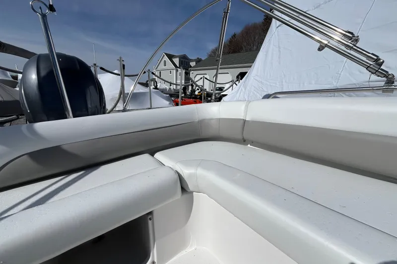 Slide: The Image of 2015 Hurricane SunDeck Sport 201 OB boat interior with seating and railing. - 20