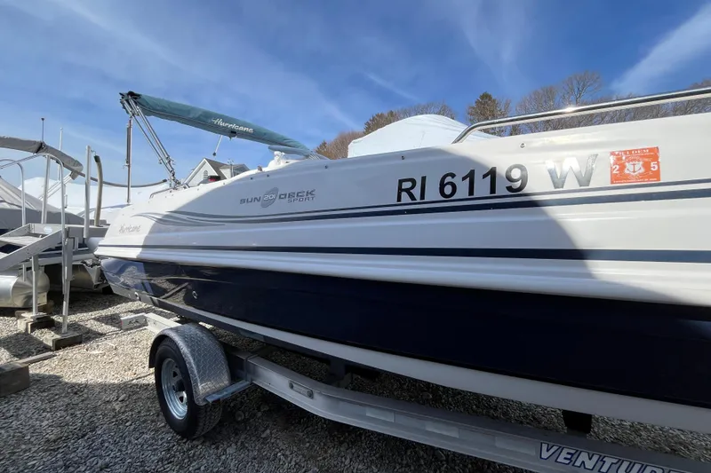 Slide: The Image of 2015 Hurricane SunDeck Sport 201 OB boat on trailer, registration RI 6119 W. - 6