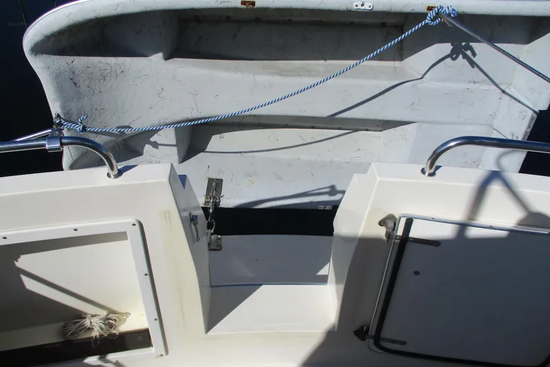 Slide: The Image of 2005 Camano Troll Flybridge boat deck with railing and storage compartment. - 18