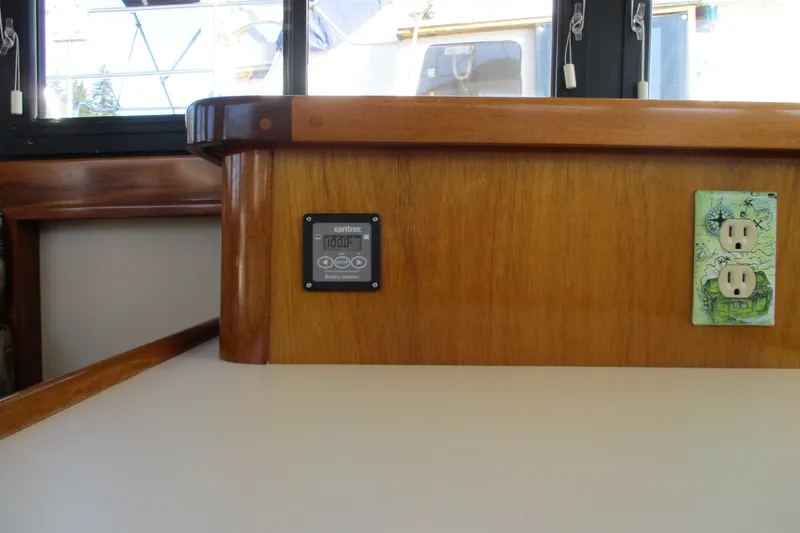 Slide: The Image of Interior of 2005 Camano Troll Flybridge with battery monitor and decorative outlet. - 31