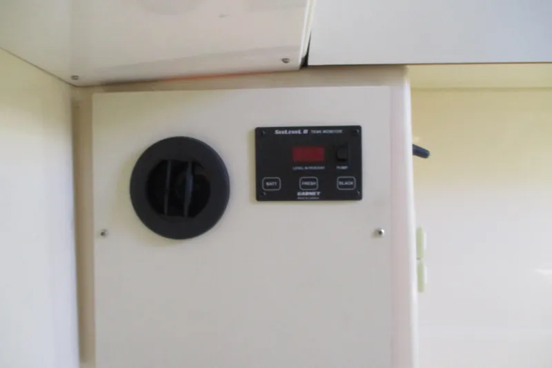 Slide: The Image of Control panel on 2005 Camano Troll Flybridge boat, featuring SeaLevel II tank monitor. - 36