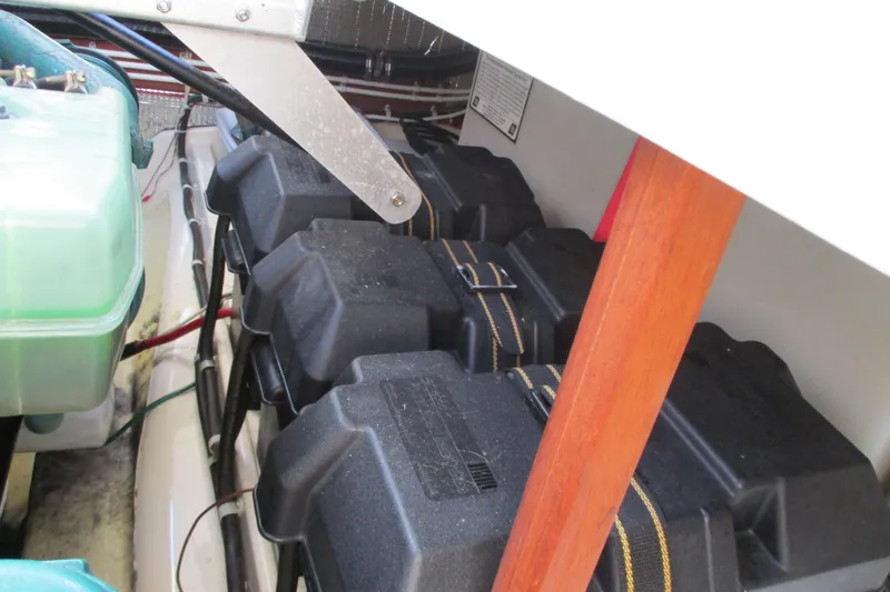 Slide: The Image of 2005 Camano Troll Flybridge engine compartment with battery boxes and wiring. - 47