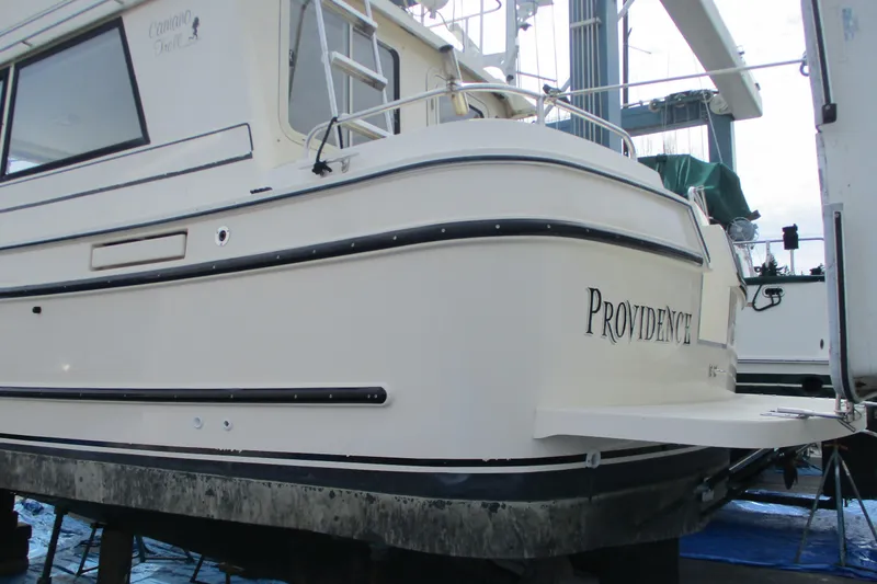 Slide: The Image of 2005 Camano Troll Flybridge boat named "Providence" on dry dock for maintenance. - 55