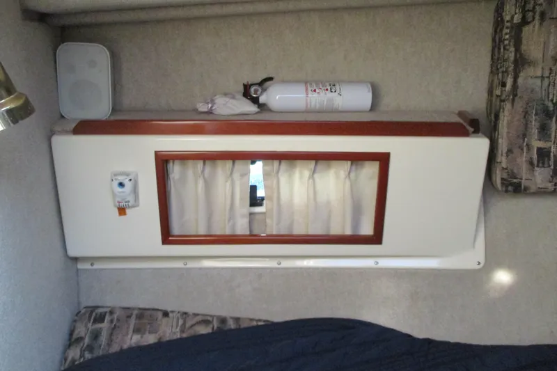 Slide: The Image of Interior of 2005 Camano Troll Flybridge with window, fire extinguisher, and speaker. - 37
