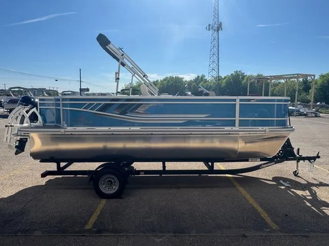 Slide: The Image of SunCatcher Select 20F 2026 pontoon boat on trailer outdoors. - 3