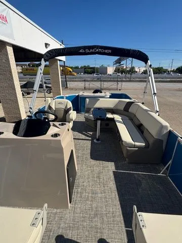 Slide: The Image of 2026 SunCatcher Select 20F pontoon boat with seating area and sunshade. - 5