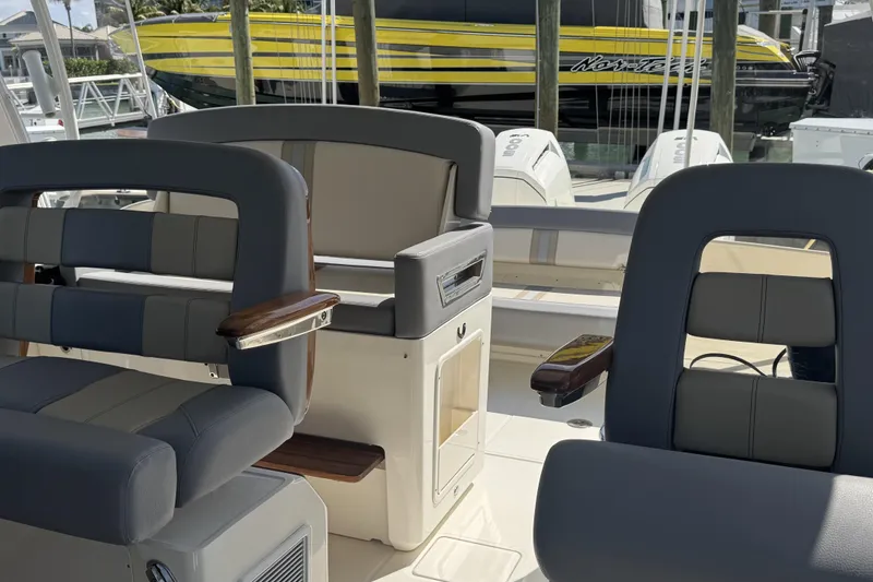 Slide: The Image of 2024 Boston Whaler 380 Realm interior with luxurious seating and modern design. - 7