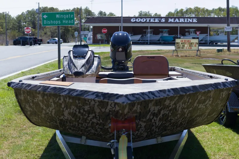 Slide: The Image of Camouflage Avid 20 Rogue SC boat on trailer near Gootee's Marine. - 3