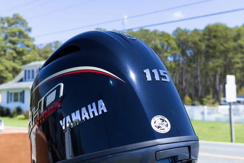 Slide: The Image of Yamaha 115 outboard motor on Avid 20 Rogue SC, 2026 model, outdoors. - 5