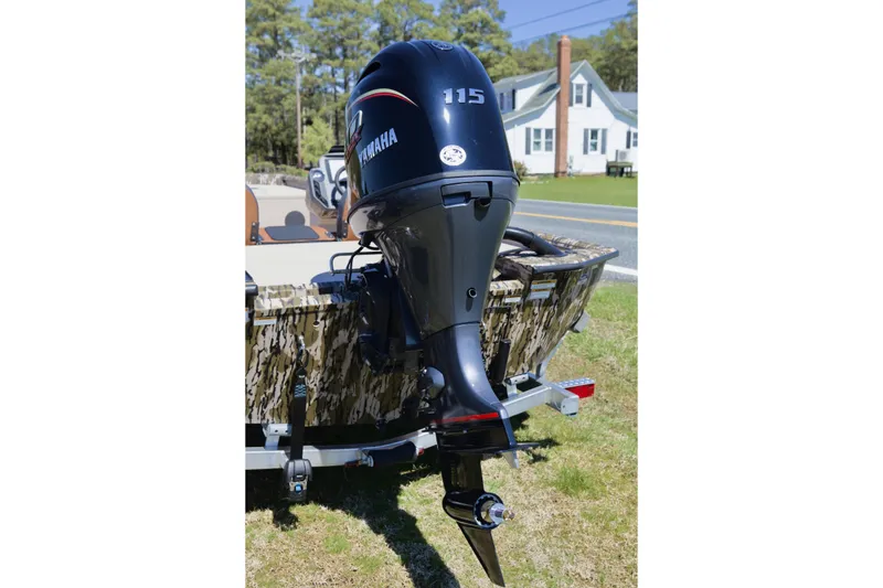 Slide: The Image of Outboard motor on Avid 20 Rogue SC boat, 2026 model, parked on grass. - 6