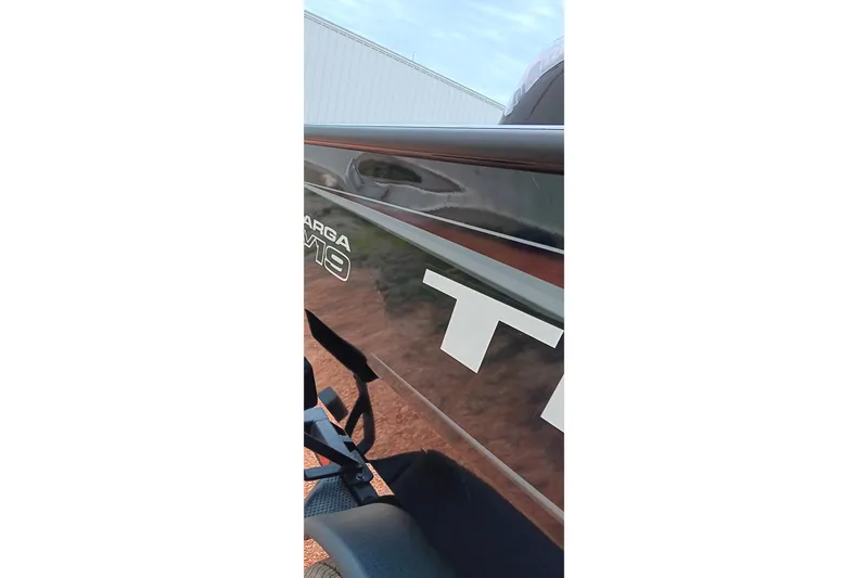 Slide: The Image of 2026 Tracker Targa V-19 WT boat side view with logo detail. - 17