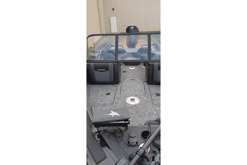 Slide: The Image of 2026 Tracker Targa V-19 WT boat interior with seating and windshield. - 18