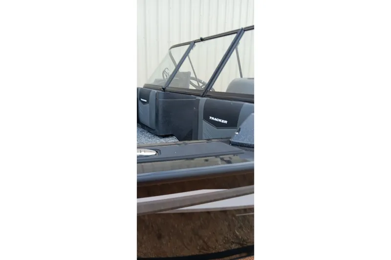 Slide: The Image of 2026 Tracker Targa V-19 WT boat with windshield and interior view. - 19