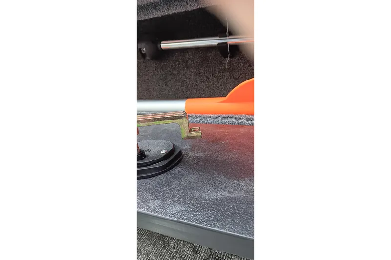 Slide: The Image of Interior view of 2026 Tracker Targa V-19 WT boat, featuring storage compartment details. - 23