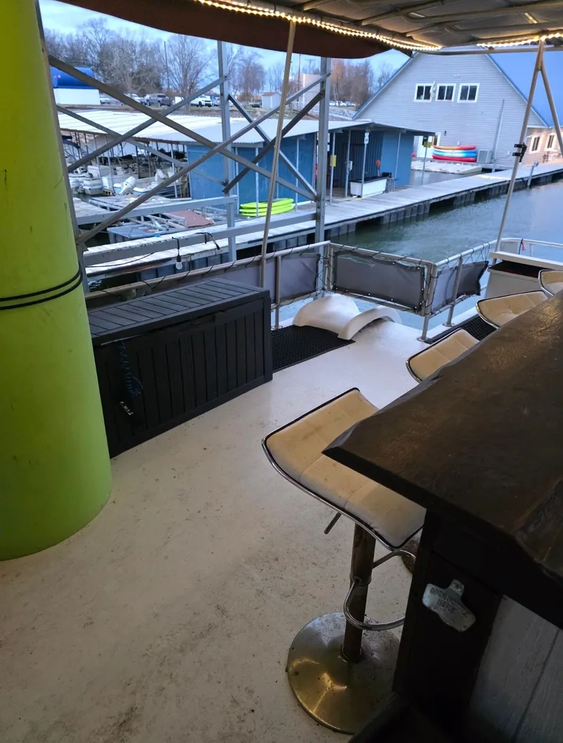 Slide: The Image of Interior of a 1992 STARDUST 53 boat with bar and harbor view. - 10