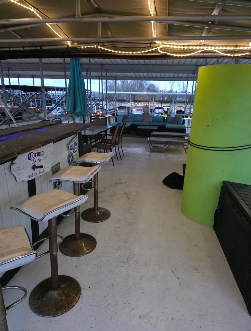 Slide: The Image of Houseboat deck with bar stools and string lights, STARDUST 53, year 1992. - 11