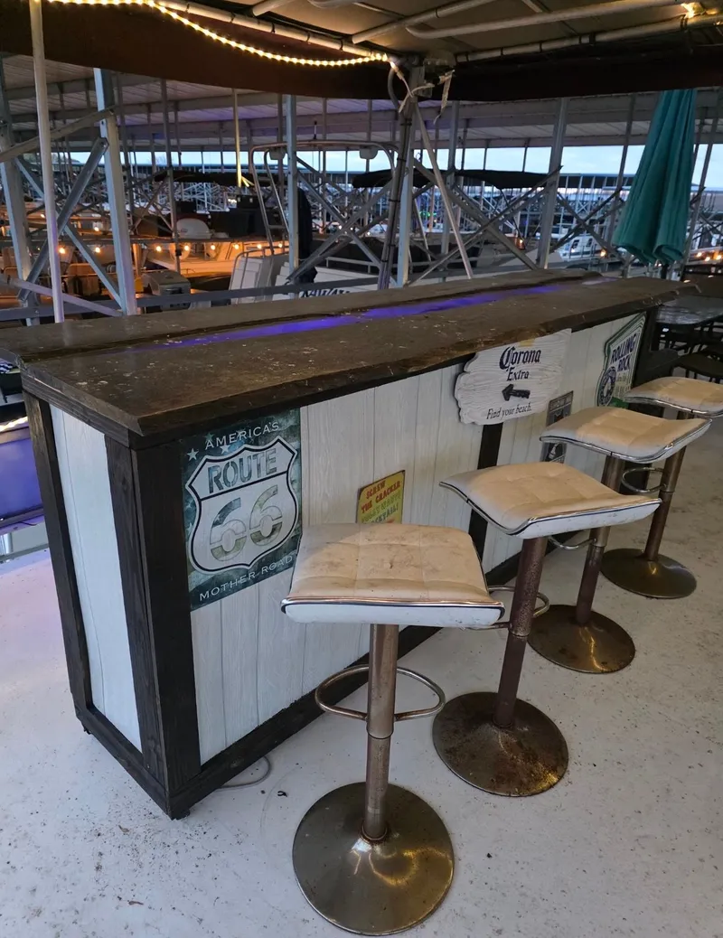 Slide: The Image of Rustic bar with stools on a 1992 STARDUST 53 boat. - 13
