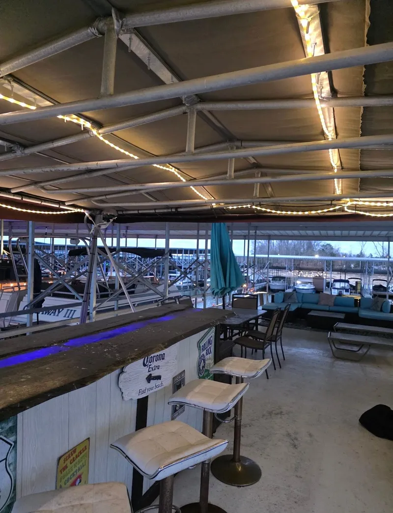 Slide: The Image of Interior of a 1992 STARDUST 53 houseboat with bar and seating area. - 14