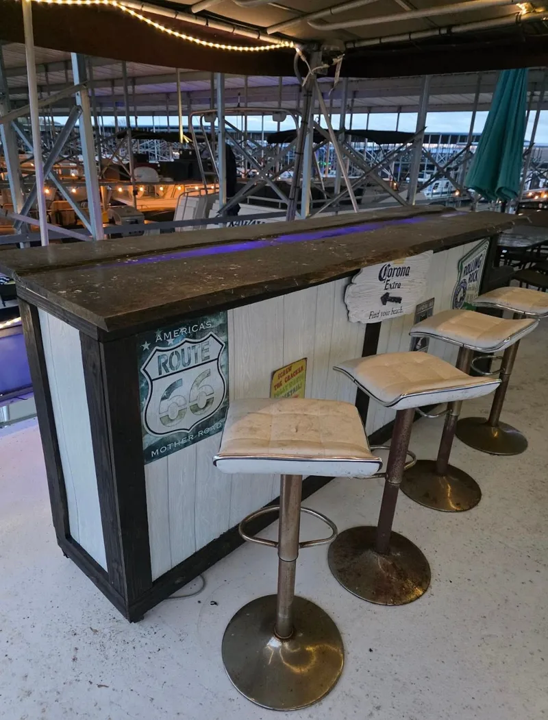 Slide: The Image of Rustic bar with stools and Route 66 decor, STARDUST 53, 1992. - 17