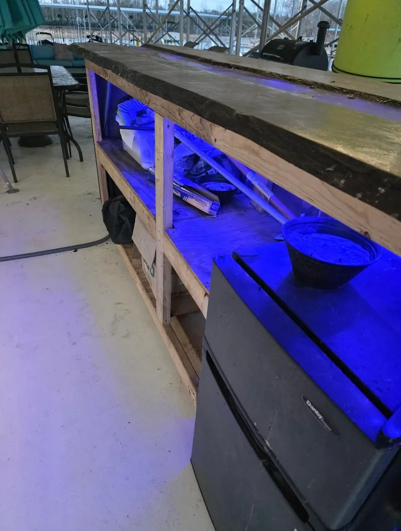 Slide: The Image of Wooden counter with blue lighting and fridge, STARDUST 53, 1992. - 18