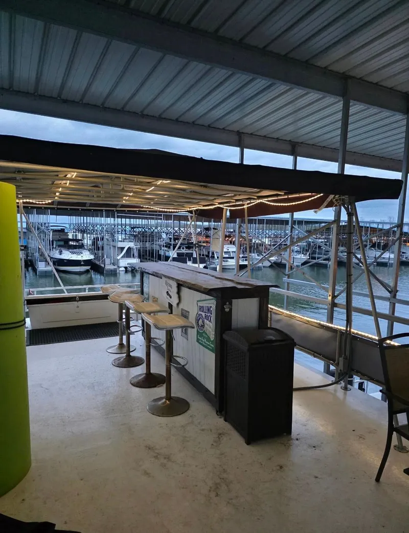 Slide: The Image of Houseboat deck with bar and marina view, STARDUST 53, 1992. - 21