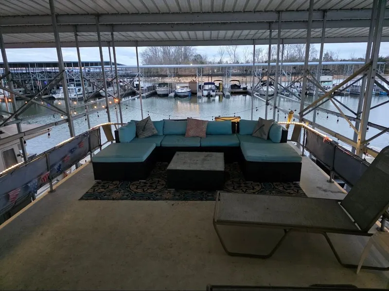 Slide: The Image of Covered deck with seating overlooking marina, STARDUST 53, 1992. - 23