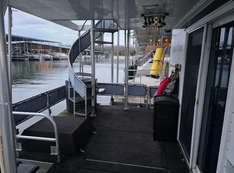 Slide: The Image of 1992 STARDUST 53 houseboat with spiral staircase and lake view. - 25