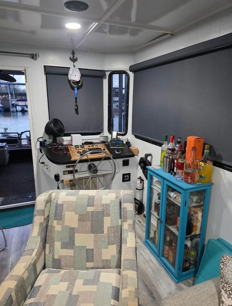 Slide: The Image of Interior of a STARDUST 53 houseboat with bar and helm area. - 27