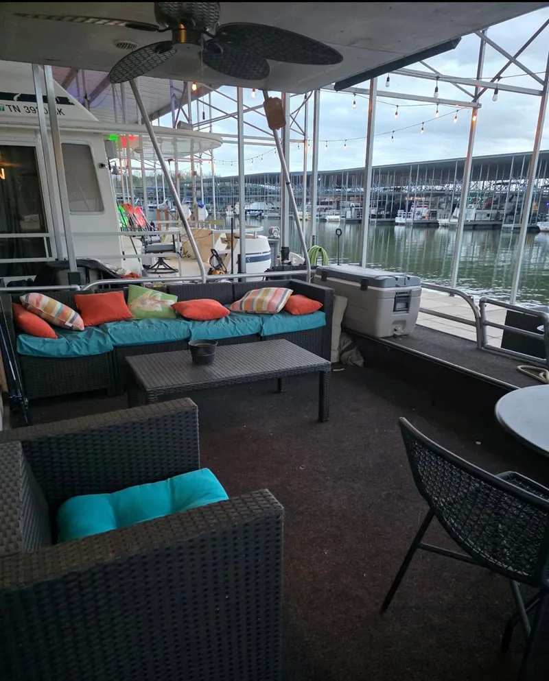 Slide: The Image of 1992 STARDUST 53 houseboat with cozy waterfront deck. - 3