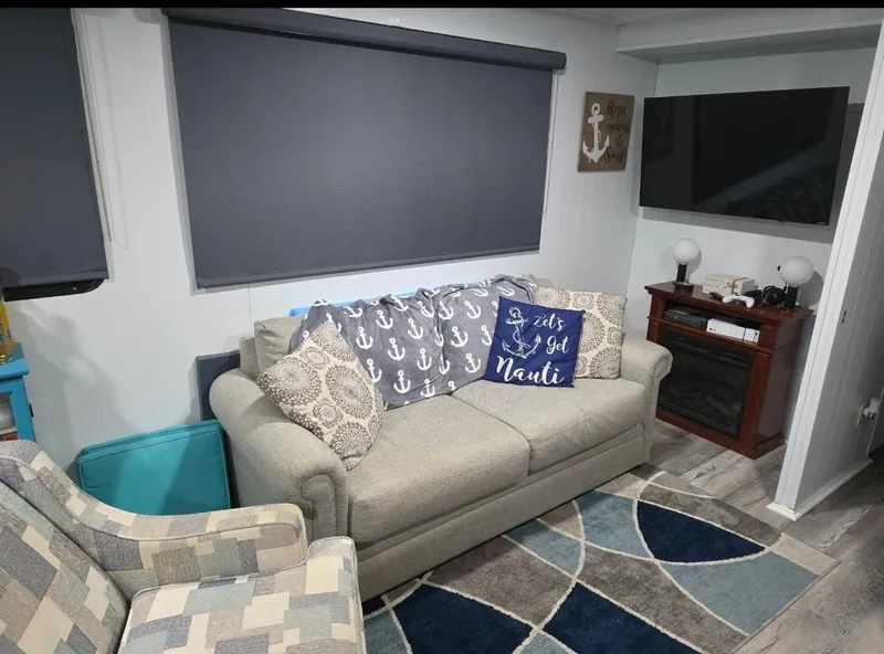 Slide: The Image of Cozy living room on STARDUST 53 houseboat, nautical decor, gray couch, TV. - 30